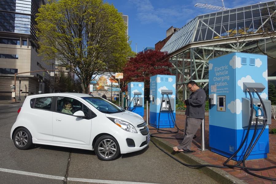 Chevy bolt charging at EV charger in city