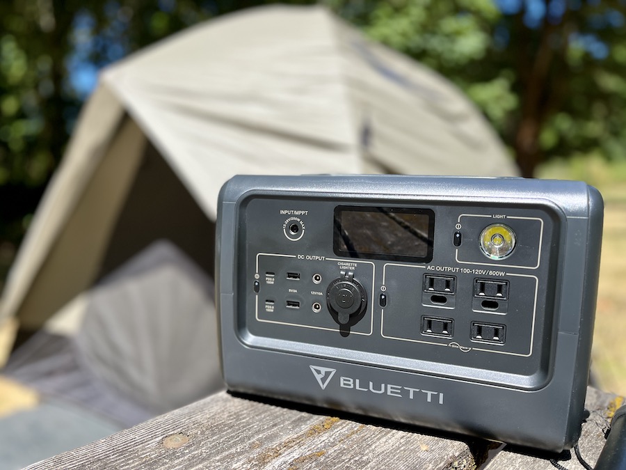 Bluetti power station in front of camping tent