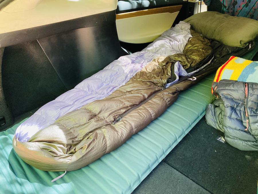 sleeping bag and mat set up in Tesla X trunk