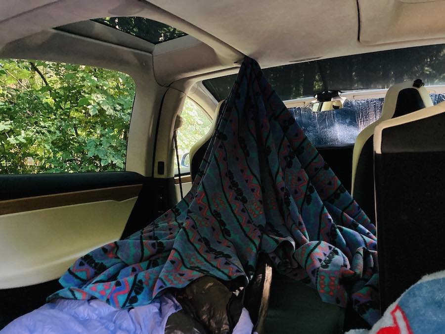 blanket attached to ceiling and domed over the top of sleeping bag