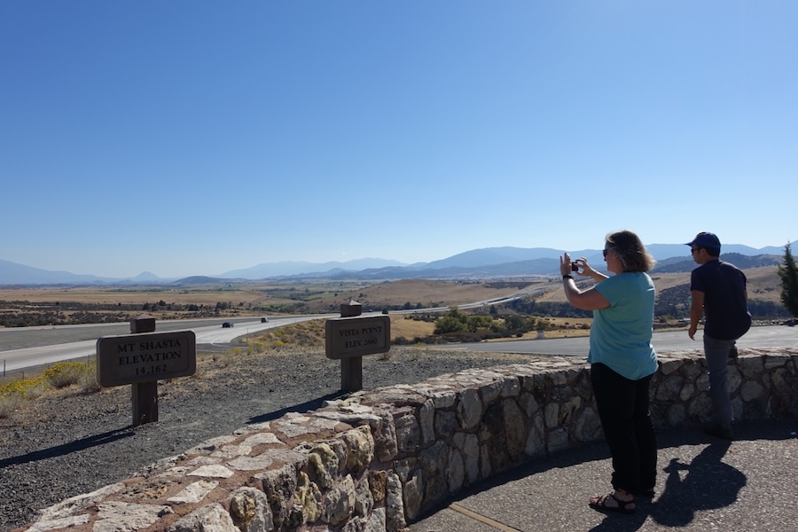 two people taking pictures at Shasta viewpoint