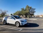 Tesla model X charging in parking lot